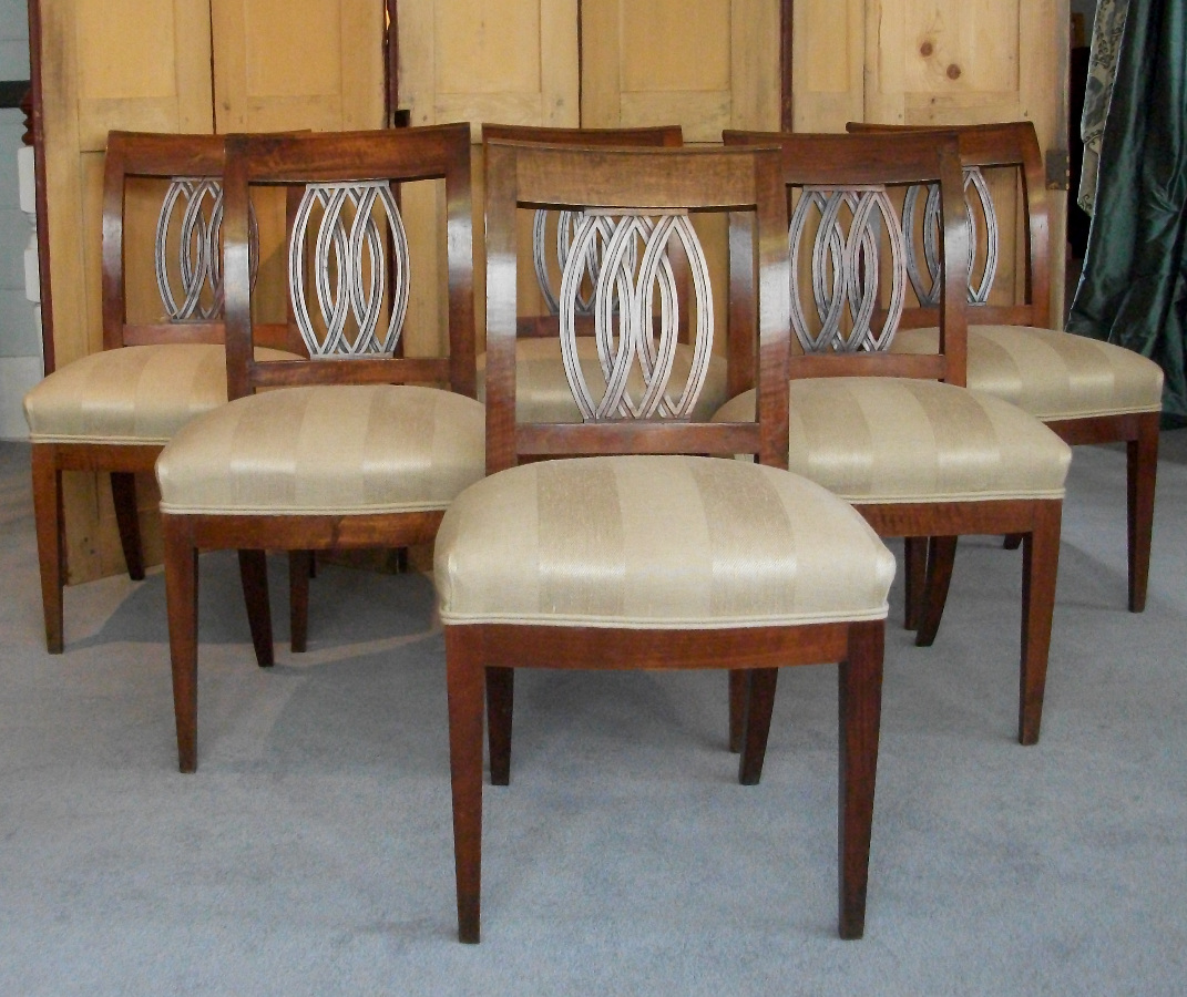 An unusual set of six walnut Italian dining chairs