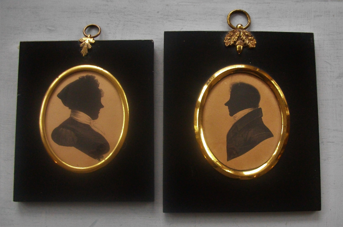 A lovely pair of Husband and Wife Silhouettes painted on card 