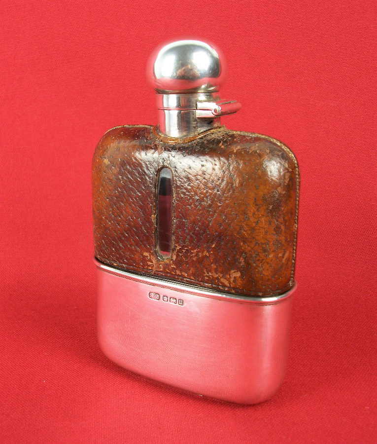 silver and leather bound hip flask